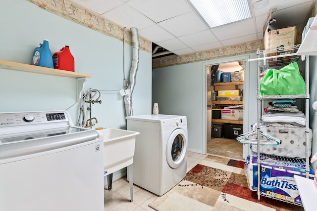 clothes washing area with washing machine and clothes dryer