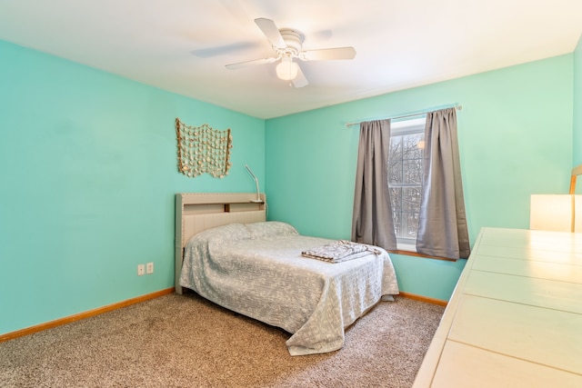 bedroom featuring ceiling fan and carpet