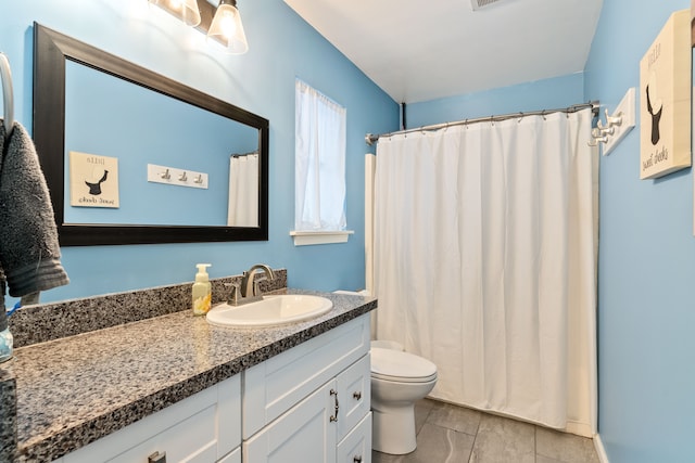 bathroom with toilet, a shower with shower curtain, and vanity