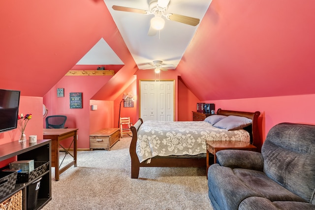 bedroom featuring vaulted ceiling, ceiling fan, a closet, and light colored carpet