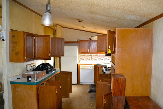 kitchen featuring decorative light fixtures, white appliances, a textured ceiling, and lofted ceiling