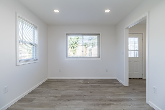 unfurnished room with light hardwood / wood-style floors