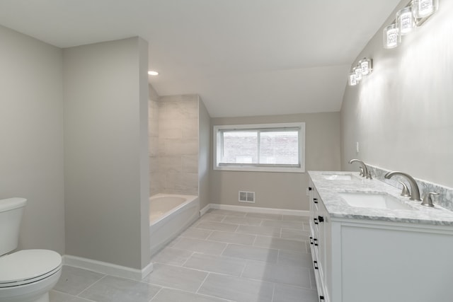 bathroom featuring vanity, tile patterned floors, toilet, and lofted ceiling