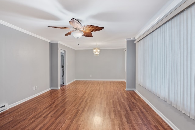 spare room with ornamental molding, hardwood / wood-style floors, and ceiling fan with notable chandelier