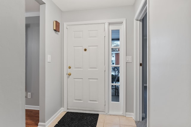 foyer with light tile patterned flooring