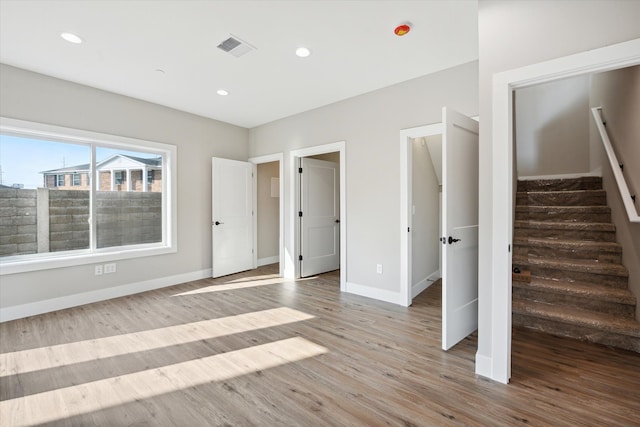 unfurnished bedroom with light hardwood / wood-style floors