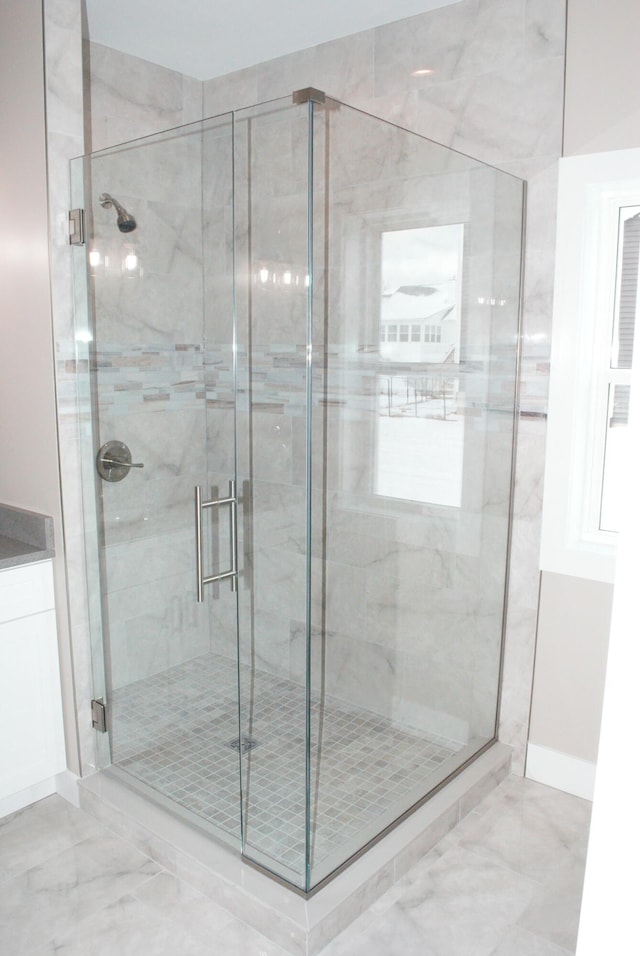 bathroom featuring an enclosed shower