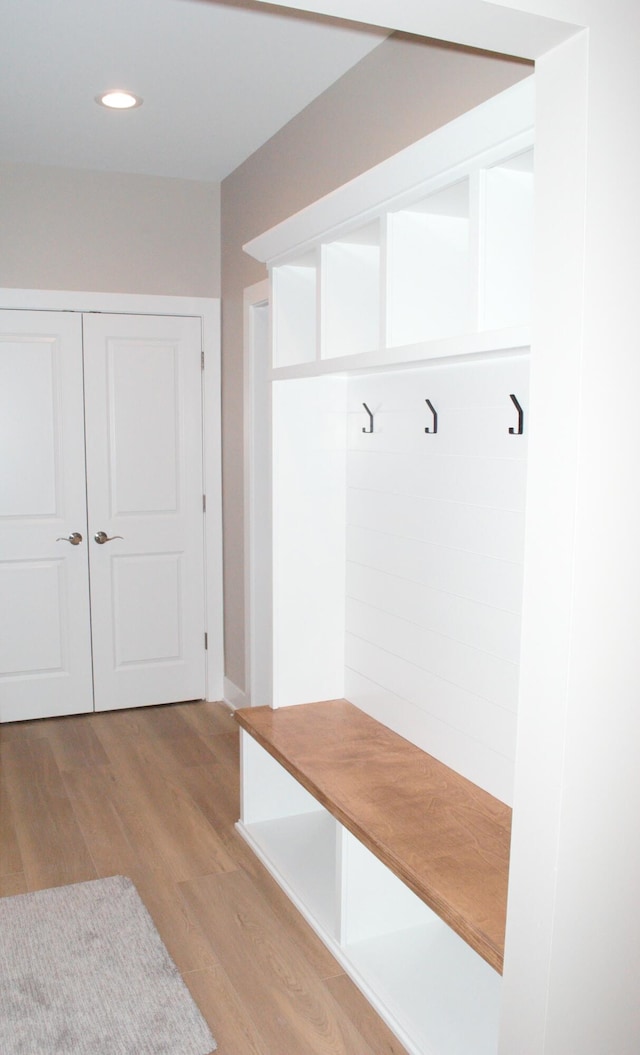 mudroom with light hardwood / wood-style flooring