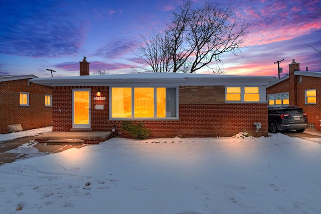 view of snow covered house