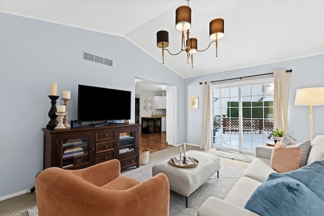 living room with vaulted ceiling and an inviting chandelier