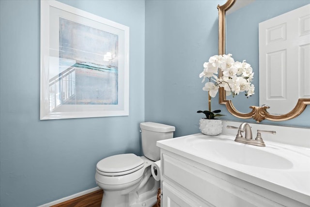 bathroom with toilet and vanity