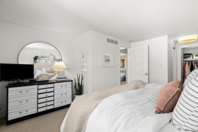 carpeted bedroom with a closet