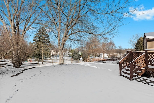 view of yard layered in snow