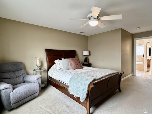 carpeted bedroom featuring ensuite bathroom and ceiling fan