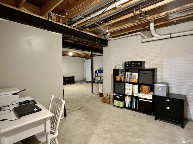 basement with brick wall