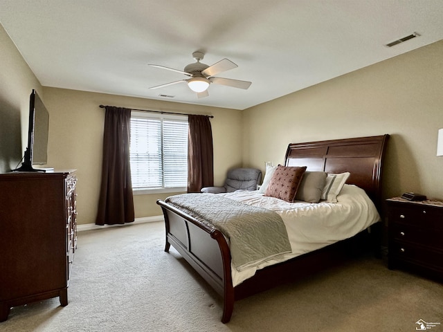 bedroom featuring ceiling fan and light colored carpet