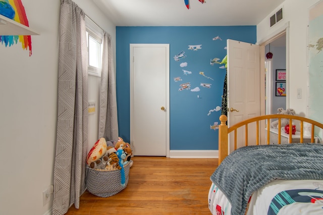 bedroom with light wood-type flooring