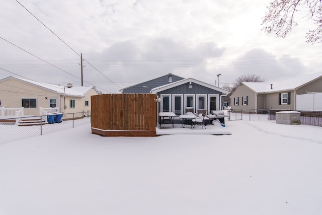 view of snow covered house