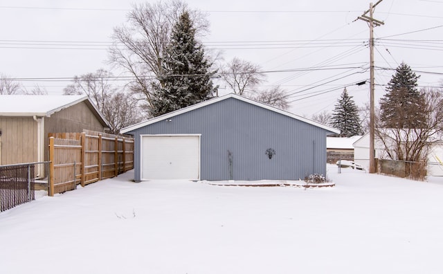 view of snow covered garage