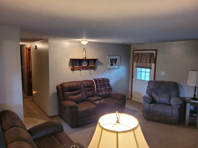 carpeted living room featuring a textured ceiling