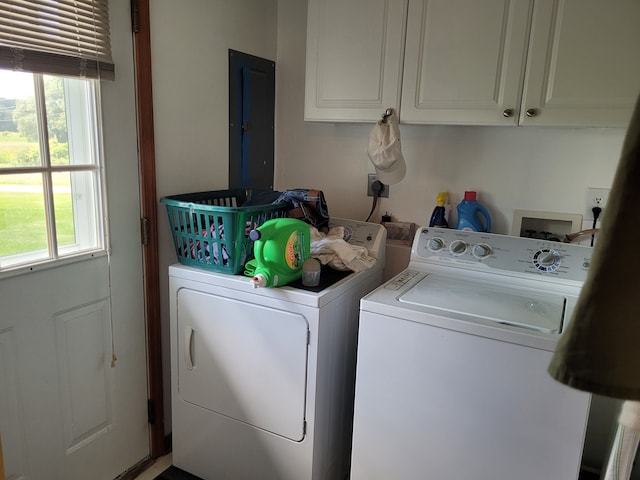 laundry area with cabinets, electric panel, and washing machine and dryer