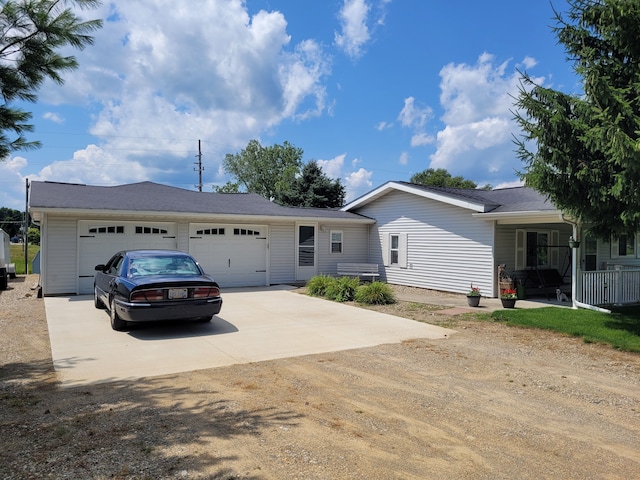 ranch-style house featuring a garage