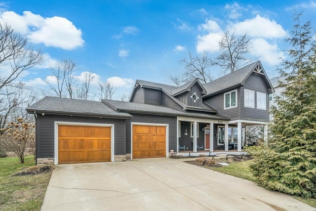 view of front of property featuring a porch and a garage