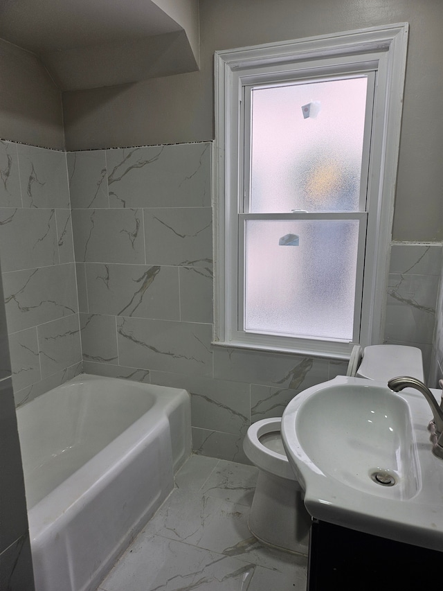 bathroom featuring tile walls, vanity, plenty of natural light, and toilet