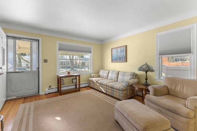 living room featuring light hardwood / wood-style floors and baseboard heating