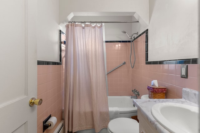 full bathroom featuring tile walls, toilet, vanity, and shower / tub combo