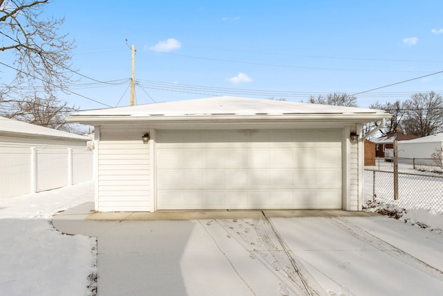 view of snow covered garage