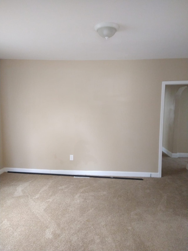 spare room with carpet flooring