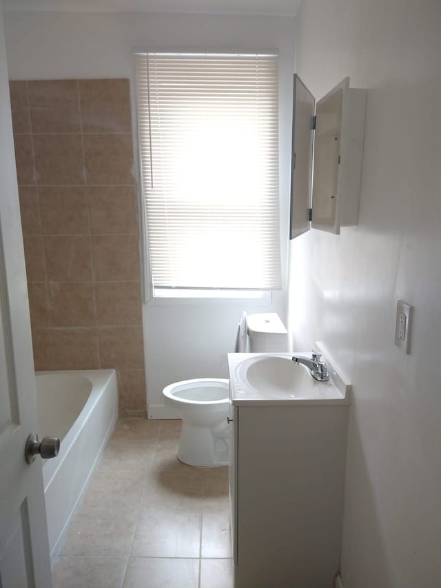 bathroom featuring tile patterned flooring, vanity, and toilet