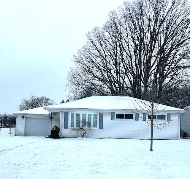 single story home featuring a garage