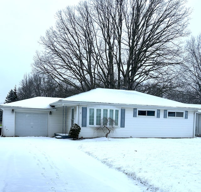 ranch-style house featuring a garage