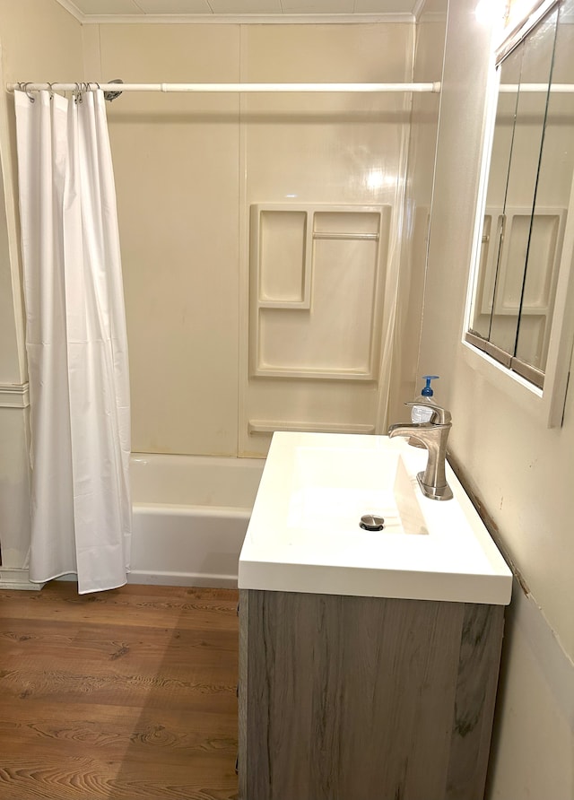 bathroom featuring shower / tub combo with curtain, vanity, and wood-type flooring