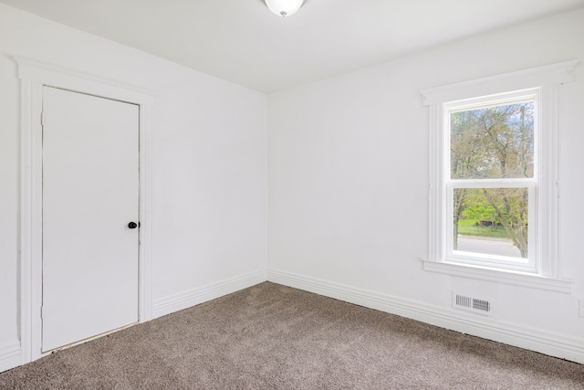 unfurnished room with carpet flooring