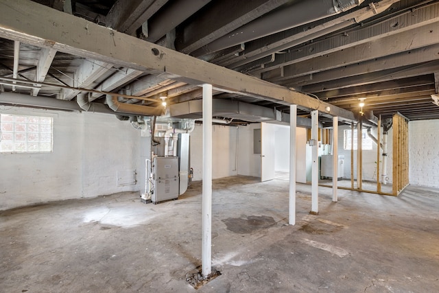 basement with washer / dryer and heating unit