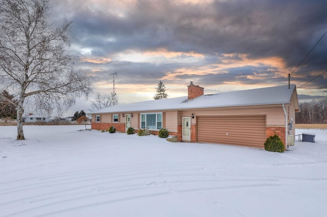 single story home featuring a garage