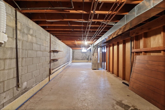 9800 Gera Rd, Birch Run, MI 48415 - unfinished below grade area featuring concrete block wall and a baseboard heating unit