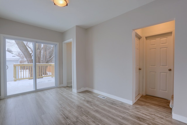 empty room featuring light hardwood / wood-style floors