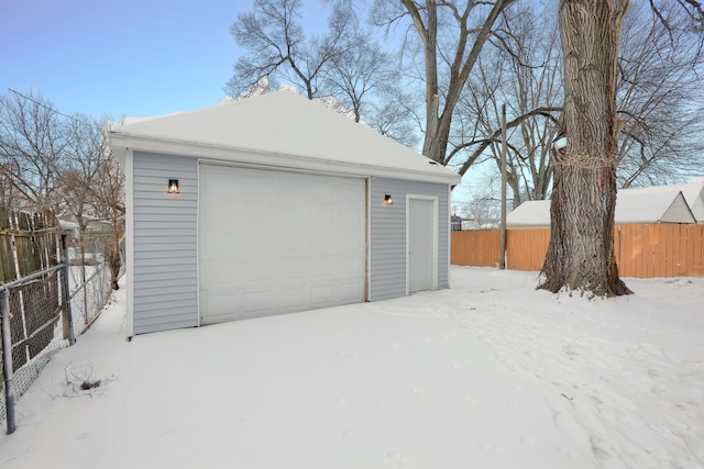 view of snow covered garage