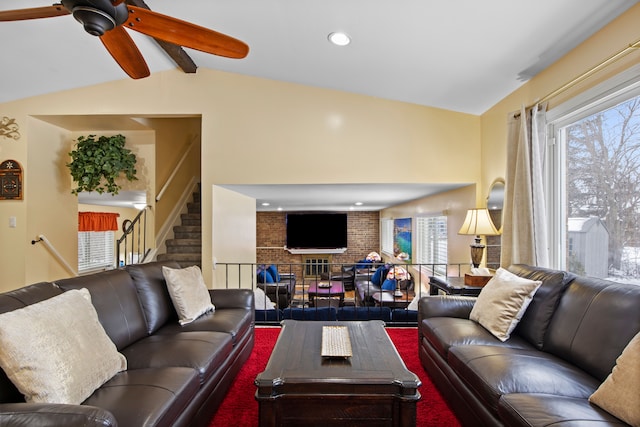 living room featuring lofted ceiling with beams and ceiling fan