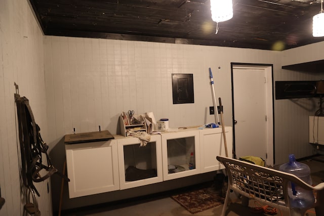 interior space featuring wooden ceiling and electric panel