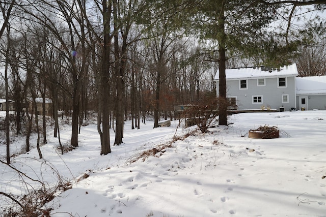 view of yard layered in snow