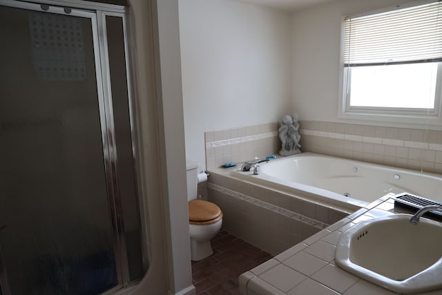 full bathroom with toilet, sink, and plus walk in shower