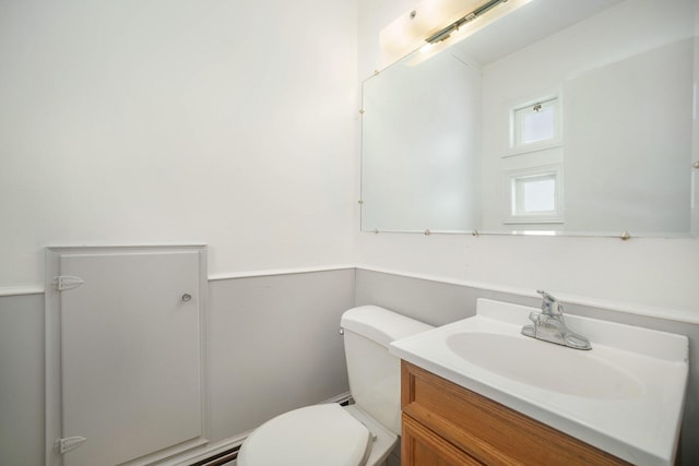 bathroom featuring toilet and vanity