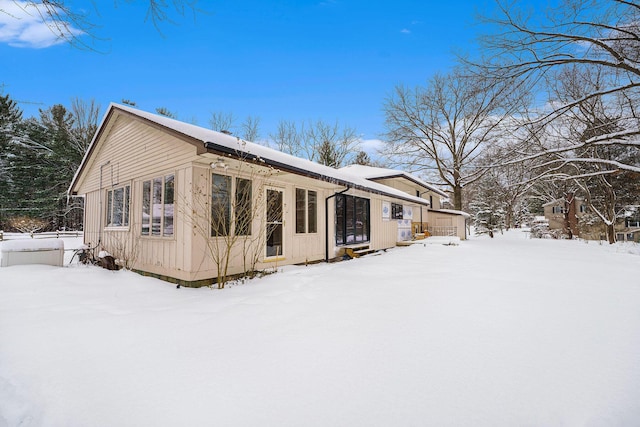 view of snow covered house