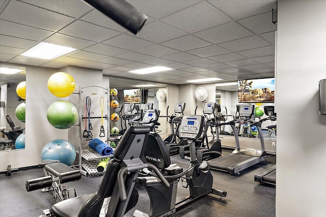 exercise room featuring a drop ceiling