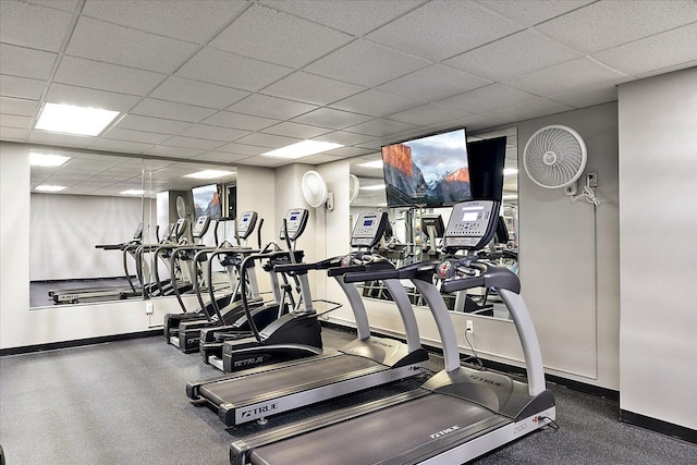 exercise room featuring a paneled ceiling